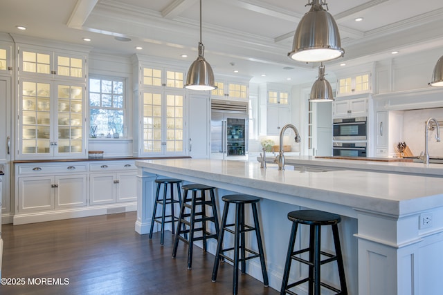 0 Wilson Cir, Rumson, NJ 07760 - kitchen with stainless steel appliances, white cabinetry, a sink, a large island, and plenty of natural light