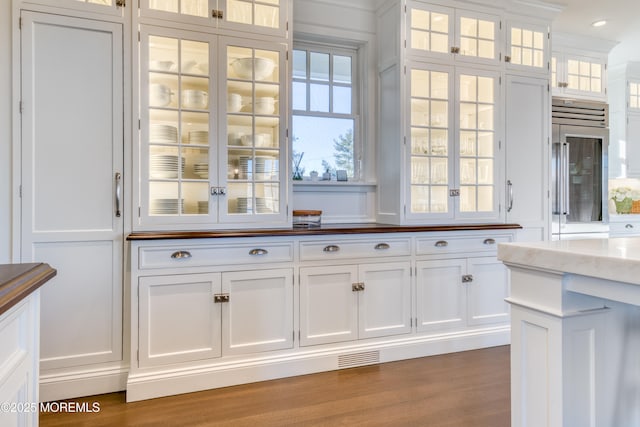 0 Wilson Cir, Rumson, NJ 07760 - kitchen featuring stainless steel built in refrigerator, white cabinetry, and glass insert cabinets