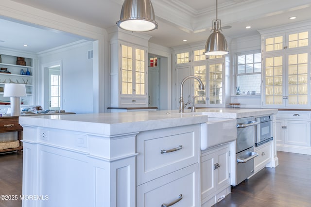 0 Wilson Cir, Rumson, NJ 07760 - kitchen with crown molding, dark wood-style flooring, glass insert cabinets, a center island with sink, and a sink