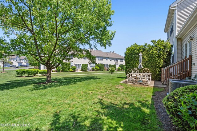 52 Straton Ct Unit 1006, Parlin, NJ 08859 - view of green lawn featuring cooling unit, a patio, and a residential view