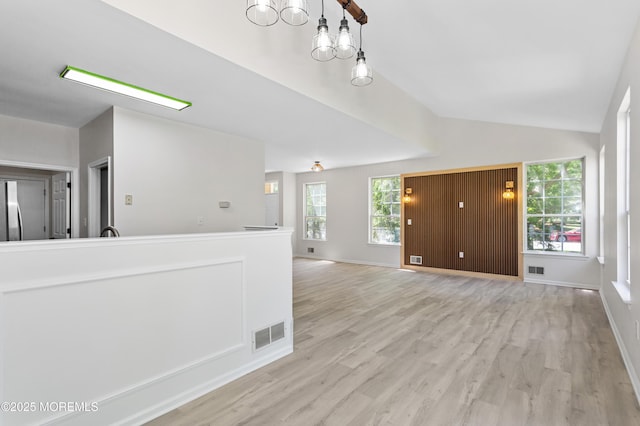 52 Straton Ct Unit 1006, Parlin, NJ 08859 - unfurnished room with vaulted ceiling, light wood finished floors, baseboards, and a chandelier