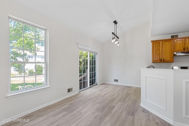 52 Straton Ct Unit 1006, Parlin, NJ 08859 - unfurnished dining area with lofted ceiling, light wood finished floors, and baseboards