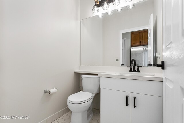 52 Straton Ct Unit 1006, Parlin, NJ 08859 - bathroom with toilet, tile patterned floors, vanity, and baseboards