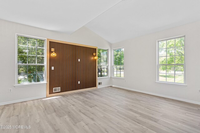 52 Straton Ct Unit 1006, Parlin, NJ 08859 - unfurnished bedroom with wood finished floors, vaulted ceiling, baseboards, and multiple windows
