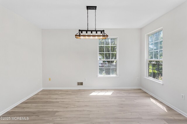 52 Straton Ct Unit 1006, Parlin, NJ 08859 - unfurnished dining area featuring light wood-style flooring and baseboards