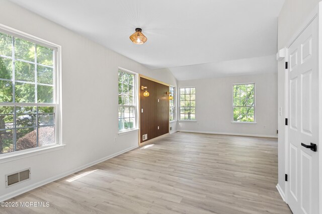 52 Straton Ct Unit 1006, Parlin, NJ 08859 - empty room with light wood-style floors, lofted ceiling, and baseboards