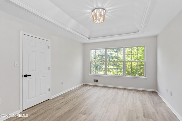 52 Straton Ct Unit 1006, Parlin, NJ 08859 - unfurnished room featuring light wood-style floors, a tray ceiling, and baseboards