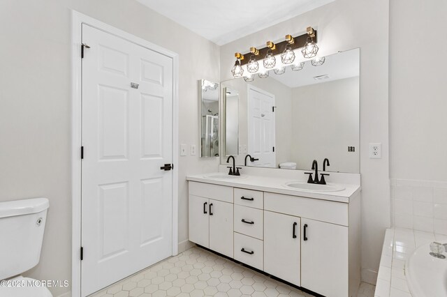 52 Straton Ct Unit 1006, Parlin, NJ 08859 - bathroom with toilet, double vanity, a bath, and tile patterned floors