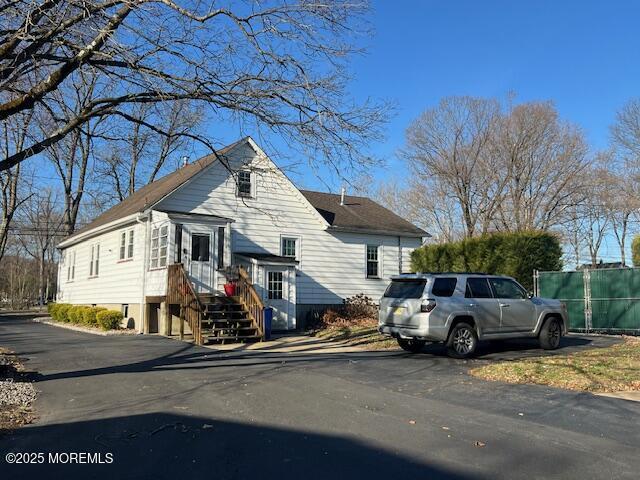 79 Davidson Mill Rd, North Brunswick, NJ 08902 - view of home's exterior featuring fence