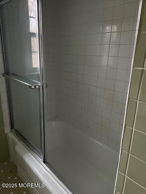 79 Davidson Mill Rd, North Brunswick, NJ 08902 - bathroom with combined bath / shower with glass door and tile patterned floors