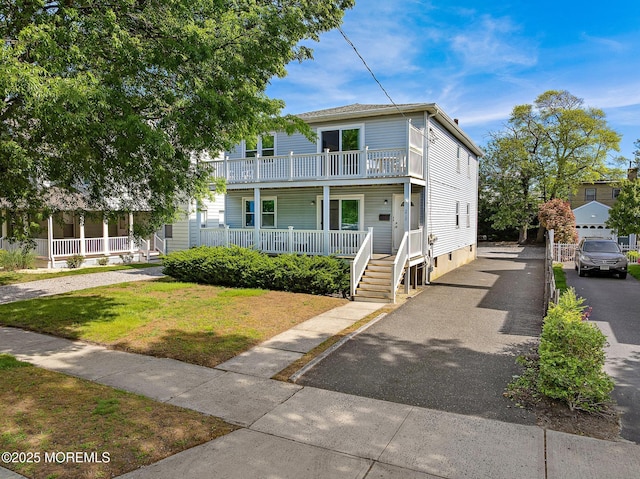 view of front of property with a porch and a front yard