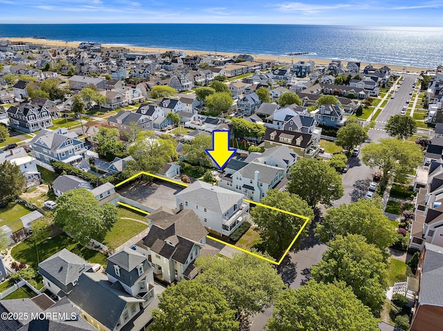 aerial view of residential area featuring property parcel outlined and a large body of water