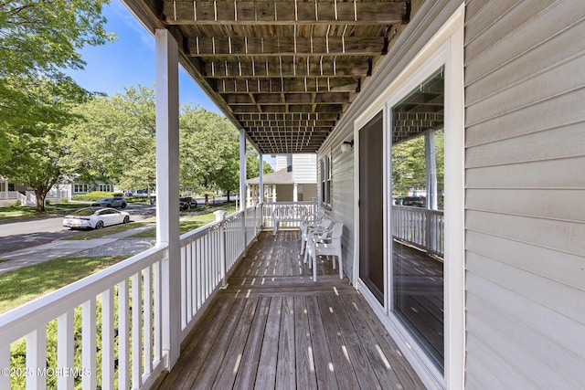 wooden terrace featuring a porch