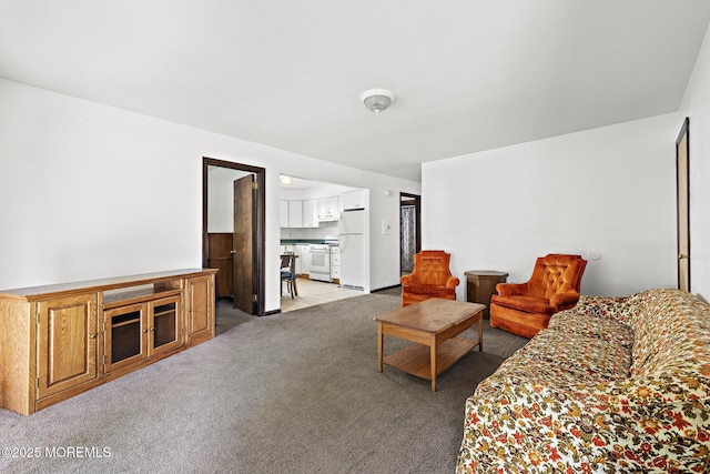 living area with light colored carpet