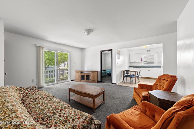 living area with light carpet