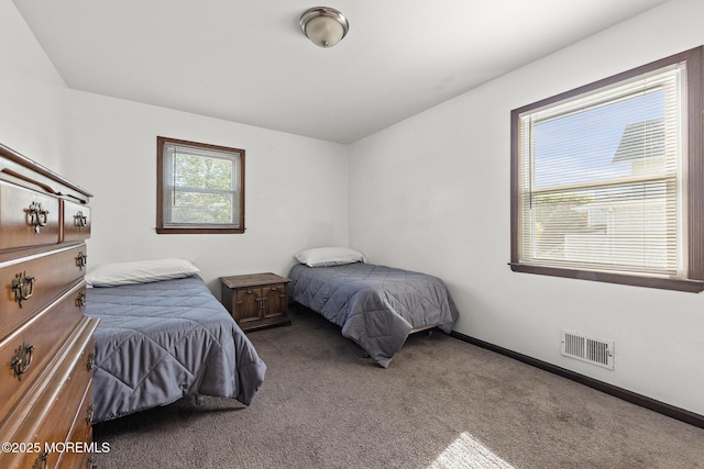 bedroom featuring carpet flooring and baseboards