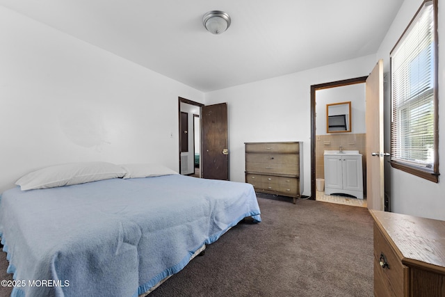 bedroom featuring carpet flooring and a sink