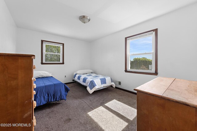 bedroom with carpet and baseboards