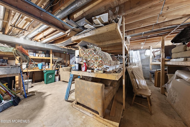 unfinished basement with a workshop area