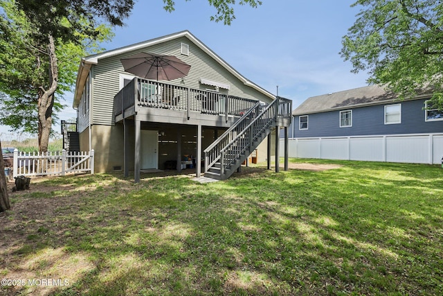 back of house featuring a deck and stairway