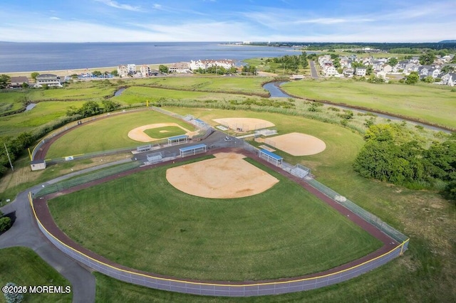 aerial view of property's location with a large body of water