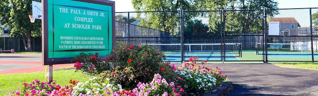 view of tennis court with fence