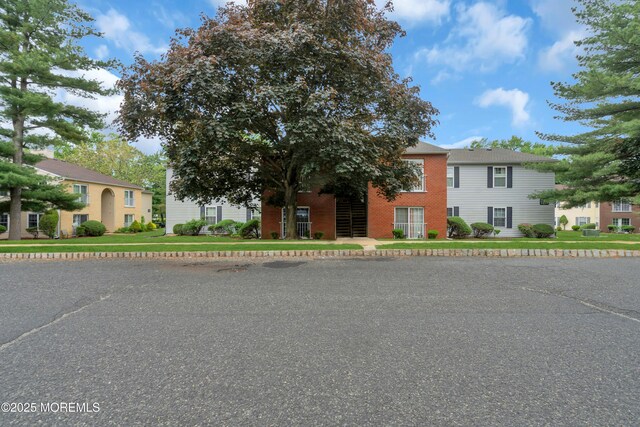 707 Zlotkin Cir Unit 7, Freehold, NJ 07728 - view of front of home with brick siding and a front yard