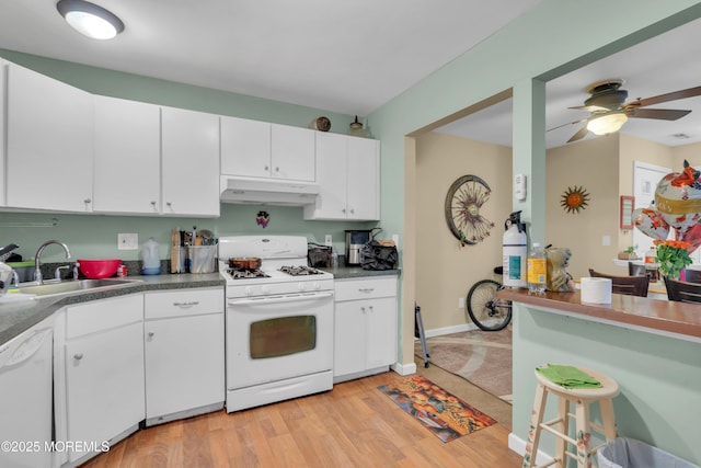 707 Zlotkin Cir Unit 7, Freehold, NJ 07728 - kitchen featuring white appliances, under cabinet range hood, a sink, a ceiling fan, and white cabinetry
