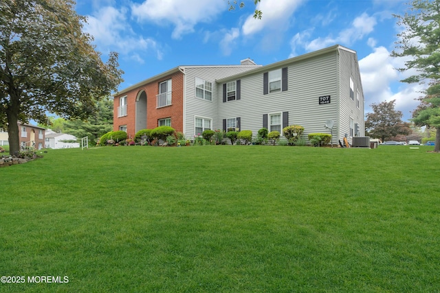 707 Zlotkin Cir Unit 7, Freehold, NJ 07728 - rear view of house with a yard and central AC