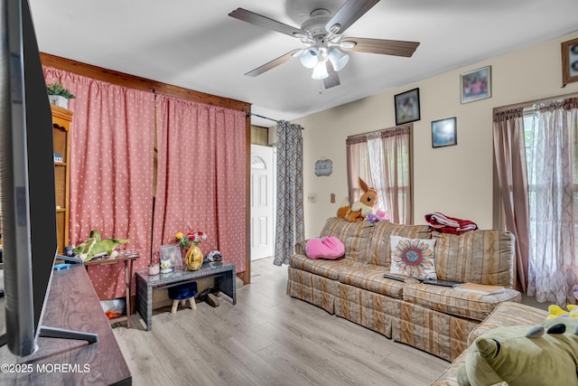 34 Bowne Ave, Freehold, NJ 07728 - living room featuring healthy amount of natural light, a ceiling fan, and wood finished floors