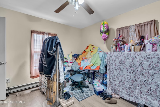 34 Bowne Ave, Freehold, NJ 07728 - bedroom featuring a baseboard radiator, wood finished floors, and a ceiling fan