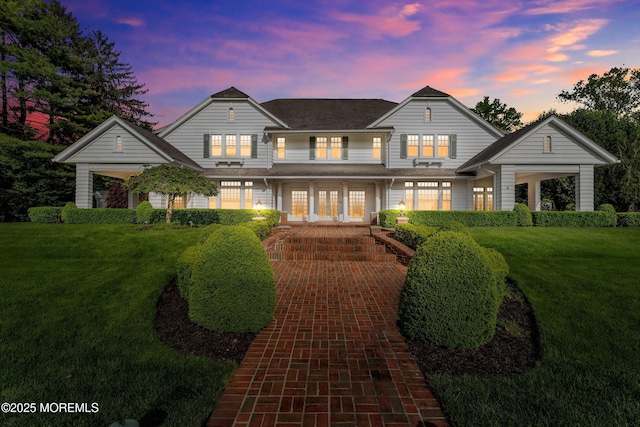 traditional home featuring a porch and a front lawn