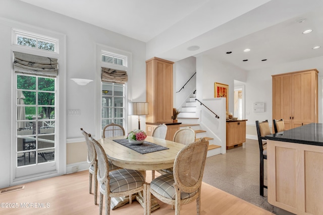 dining space with stairway, baseboards, and recessed lighting