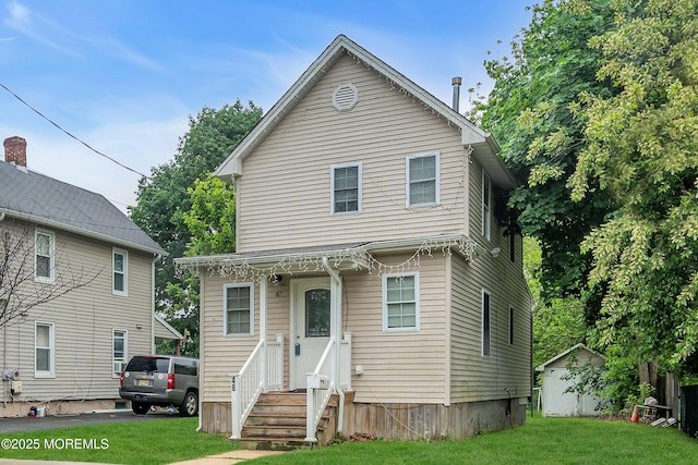 48 Bannard St, Freehold, NJ 07728 - view of front of house with entry steps and a front yard