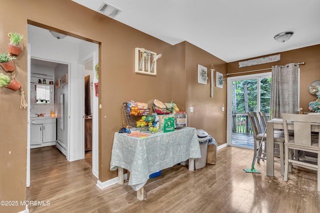 48 Bannard St, Freehold, NJ 07728 - dining space featuring wood finished floors and baseboards