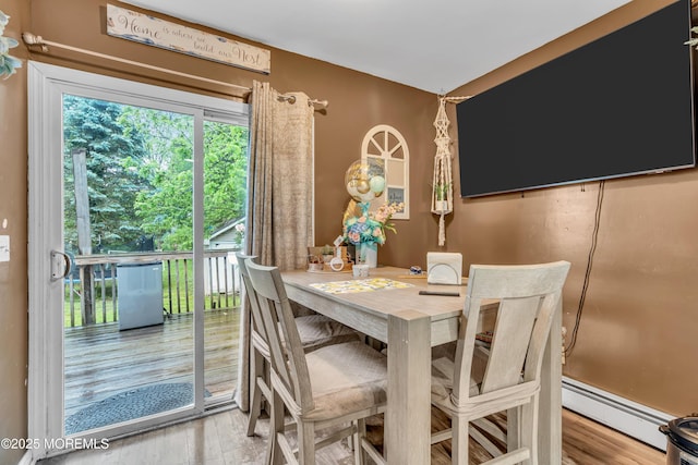 48 Bannard St, Freehold, NJ 07728 - dining area featuring a baseboard radiator and wood finished floors