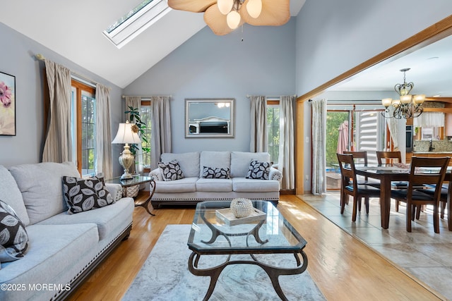 22 Cloverleaf Dr, Marlboro, NJ 07746 - living room featuring high vaulted ceiling, a chandelier, wood finished floors, ceiling fan, and a skylight