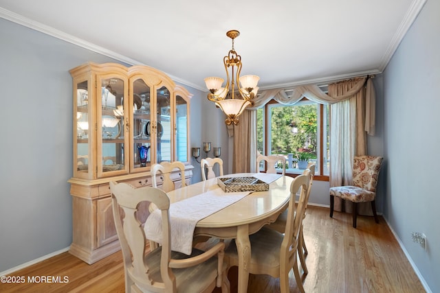 22 Cloverleaf Dr, Marlboro, NJ 07746 - dining room featuring a chandelier, crown molding, light wood-type flooring, and baseboards