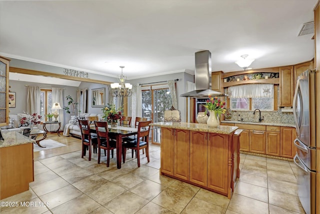 22 Cloverleaf Dr, Marlboro, NJ 07746 - kitchen with island exhaust hood, freestanding refrigerator, a chandelier, crown molding, and plenty of natural light