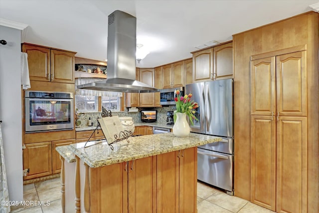 22 Cloverleaf Dr, Marlboro, NJ 07746 - kitchen with appliances with stainless steel finishes, island exhaust hood, light tile patterned floors, light stone counters, and backsplash