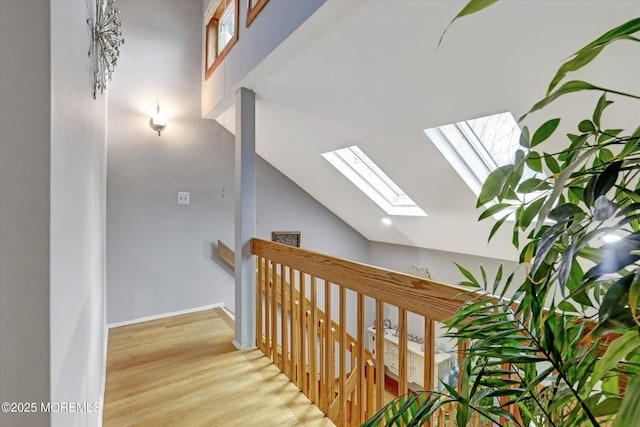 22 Cloverleaf Dr, Marlboro, NJ 07746 - stairs with a skylight, lofted ceiling, and wood finished floors