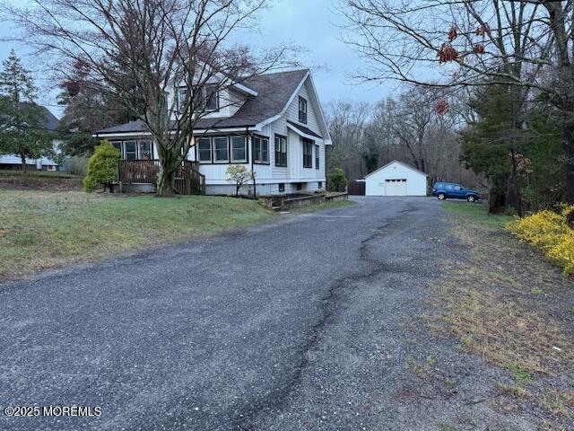 1454 Rte 9, Toms River, NJ 08755 - view of front of home with a garage, an outdoor structure, and driveway