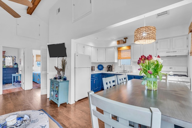 233 Harbor Dr, Lavallette, NJ 08735 - dining area featuring dark wood finished floors, beam ceiling, a towering ceiling, and recessed lighting