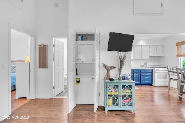 233 Harbor Dr, Lavallette, NJ 08735 - bedroom featuring stacked washing machine and dryer and wood finished floors