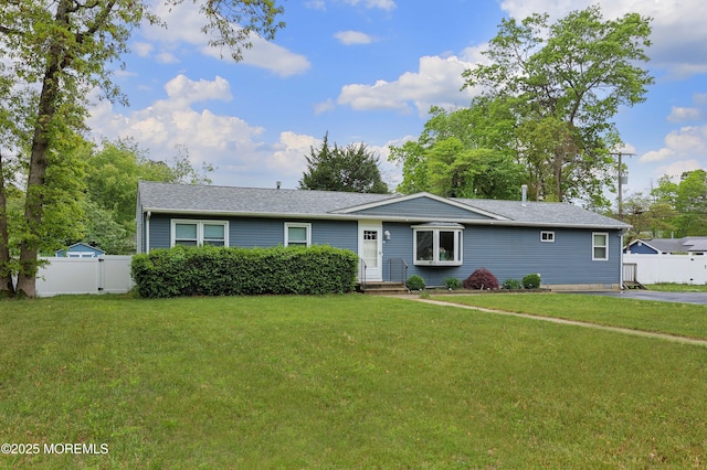 single story home with a shingled roof