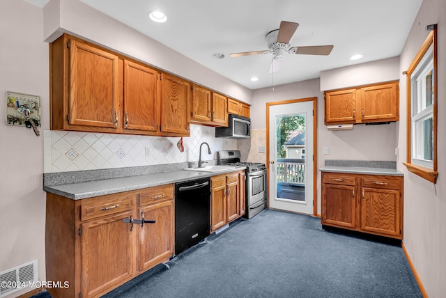 kitchen with stainless steel appliances, a sink, ceiling fan, tasteful backsplash, and recessed lighting