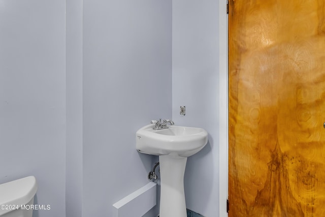 half bath featuring toilet