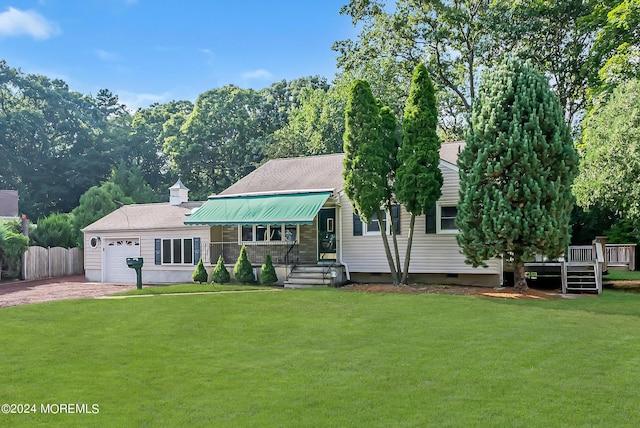 view of front of home with dirt driveway and a garage