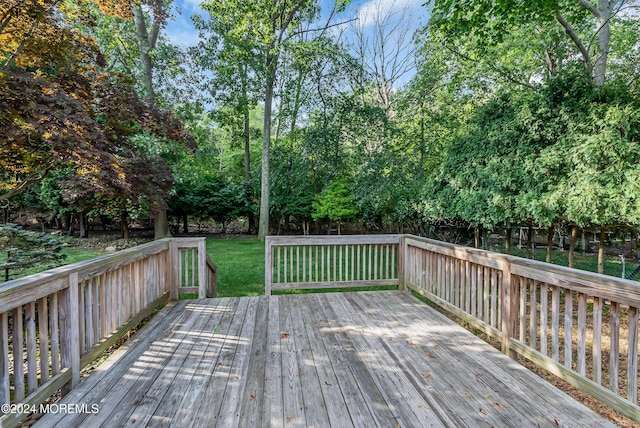 wooden terrace with view of scattered trees
