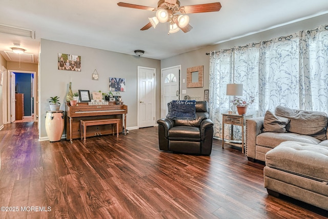 living room featuring attic access, ceiling fan, dark wood finished floors, and baseboards